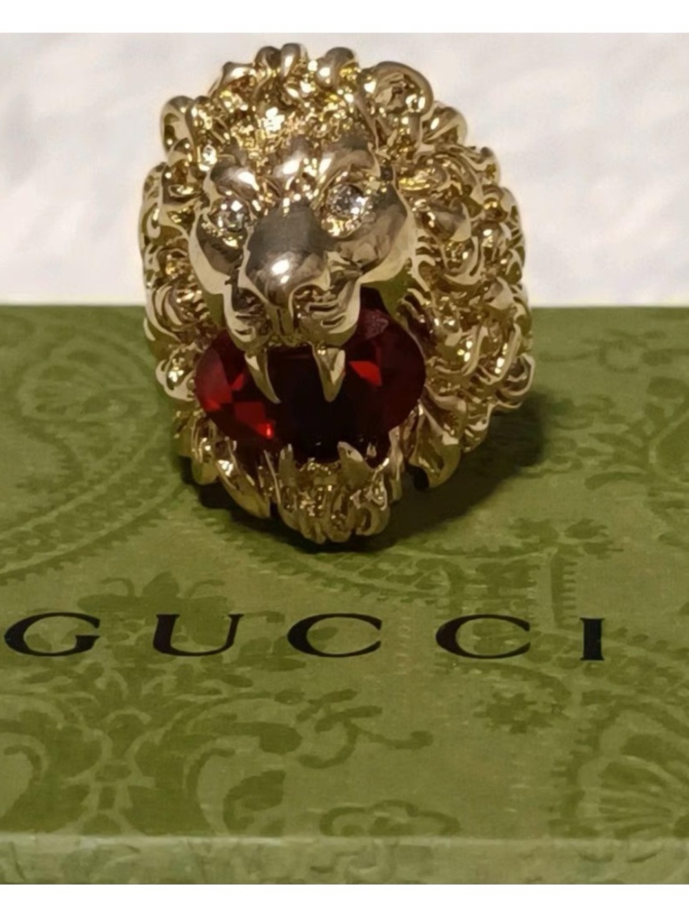 Unisex Gucci, Lionhead motif gold tone with red crystal size 8.5 made in Italy